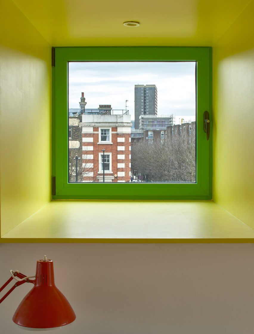 Yellow window framing view of London