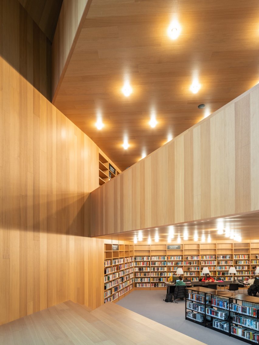 Interior image of a wood-lined library 