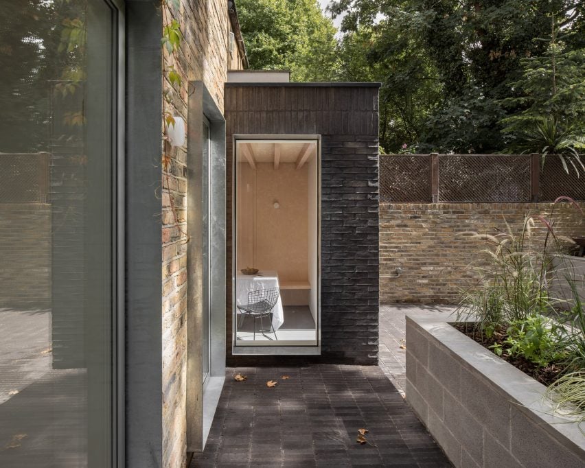 Dark-brick house extension in London