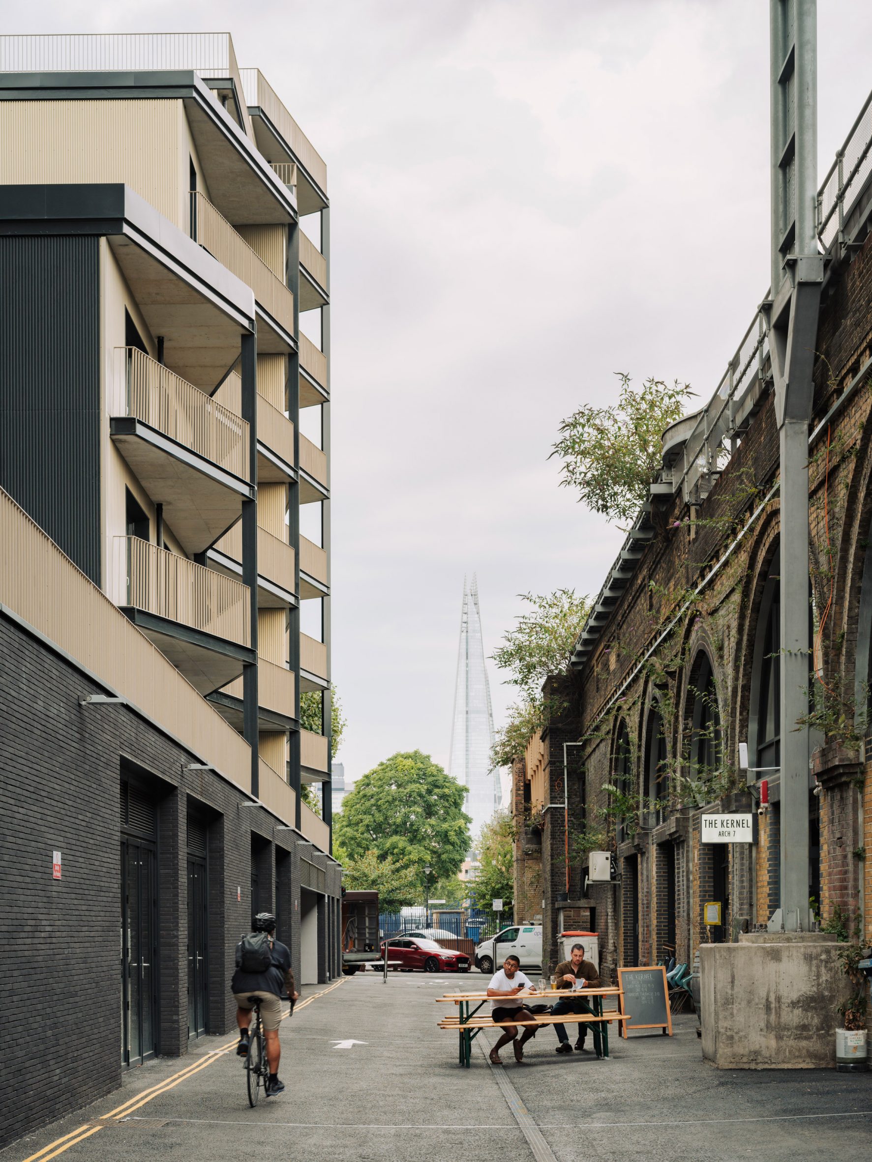 Dockley Apartments by Studio Woodroffe Papa and Poggi Architecture beside railway arches