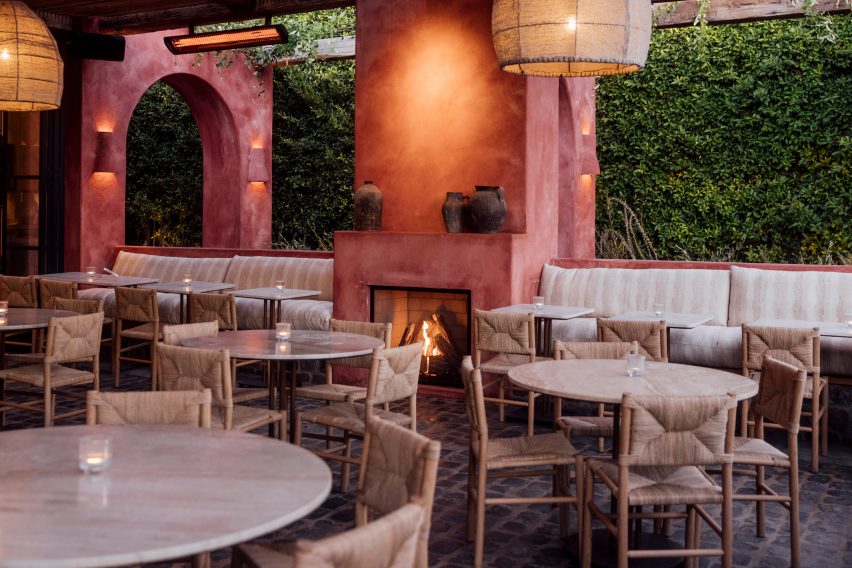 Pink fireplace in outdoor dining area