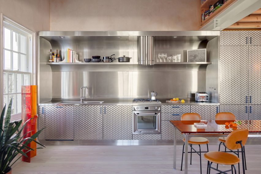 Front-on image of residential kitchen informed by fast food outlets