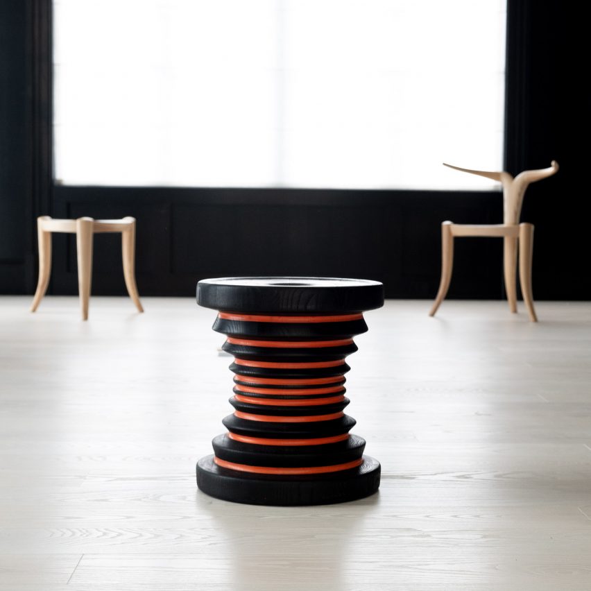 A black and red stool by Jomo Tariku