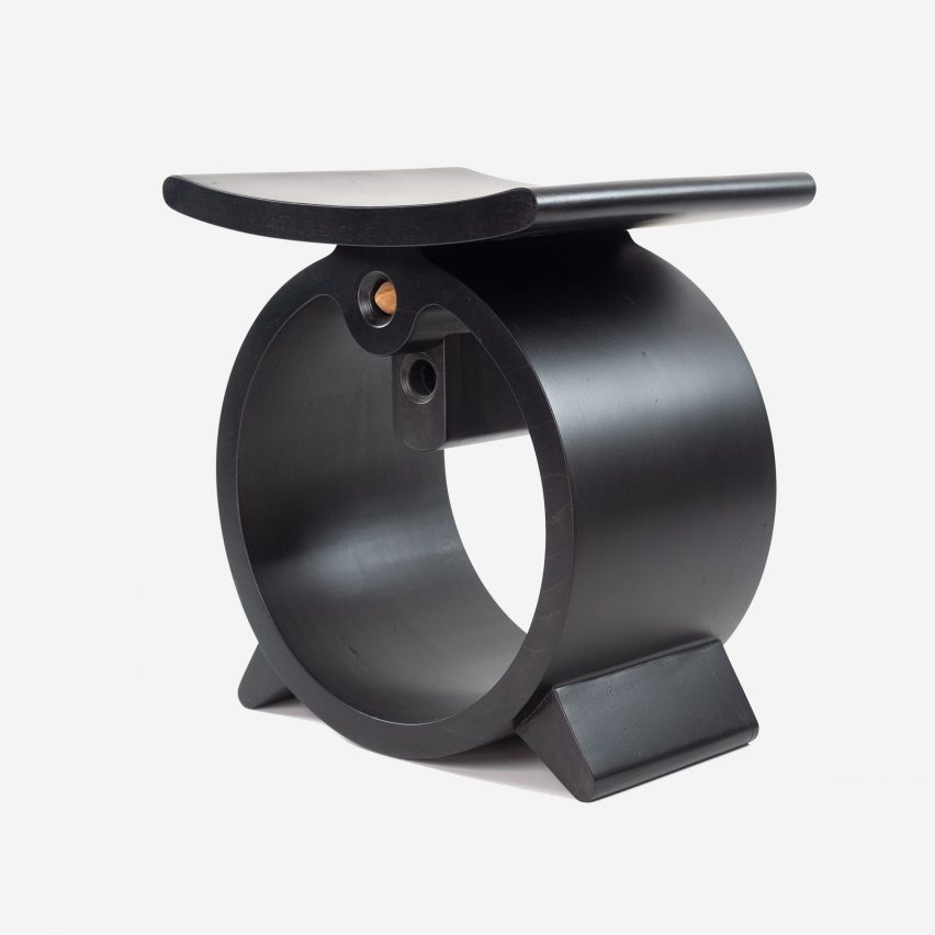 A black rounded Ashanti stool