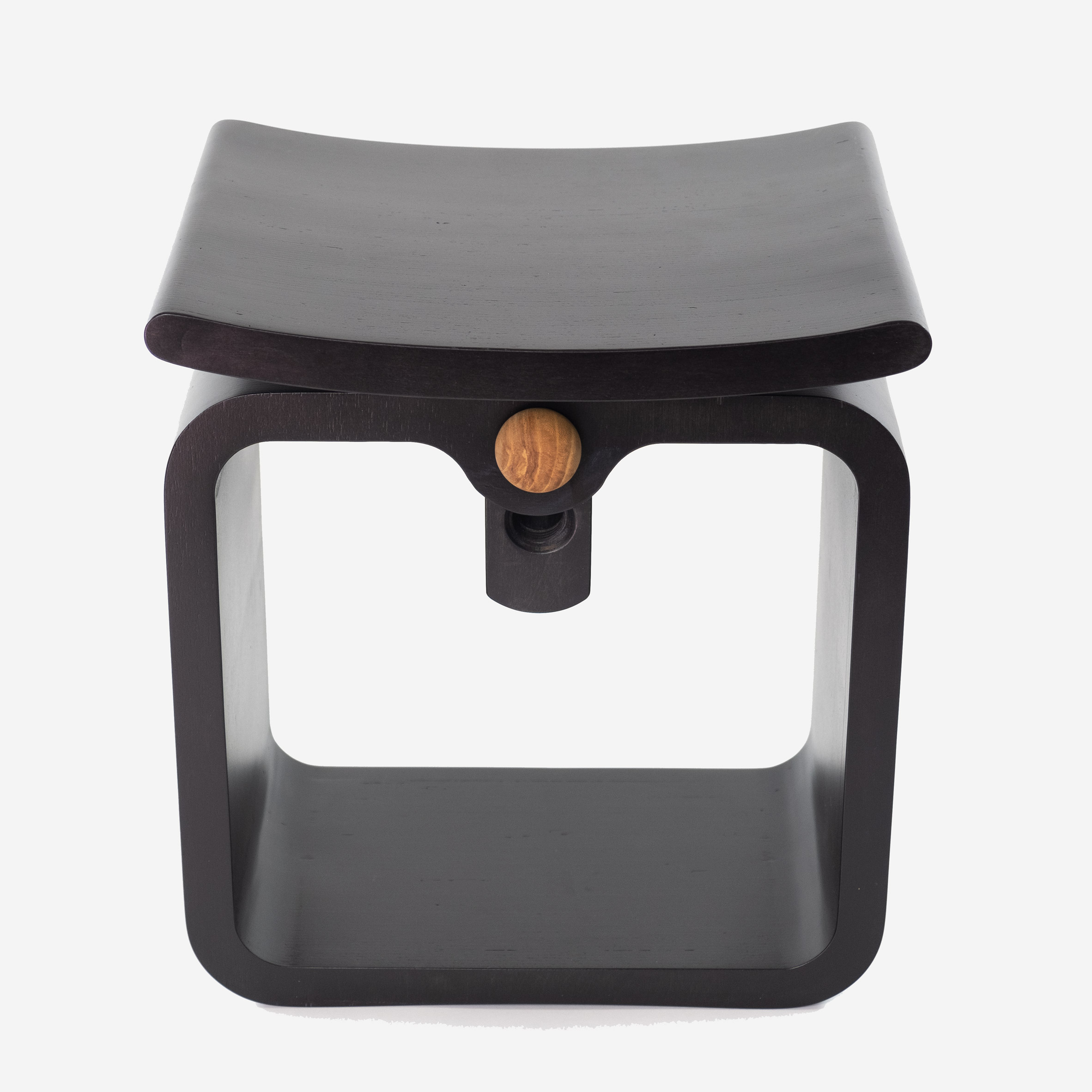 A black stool with a curved seat