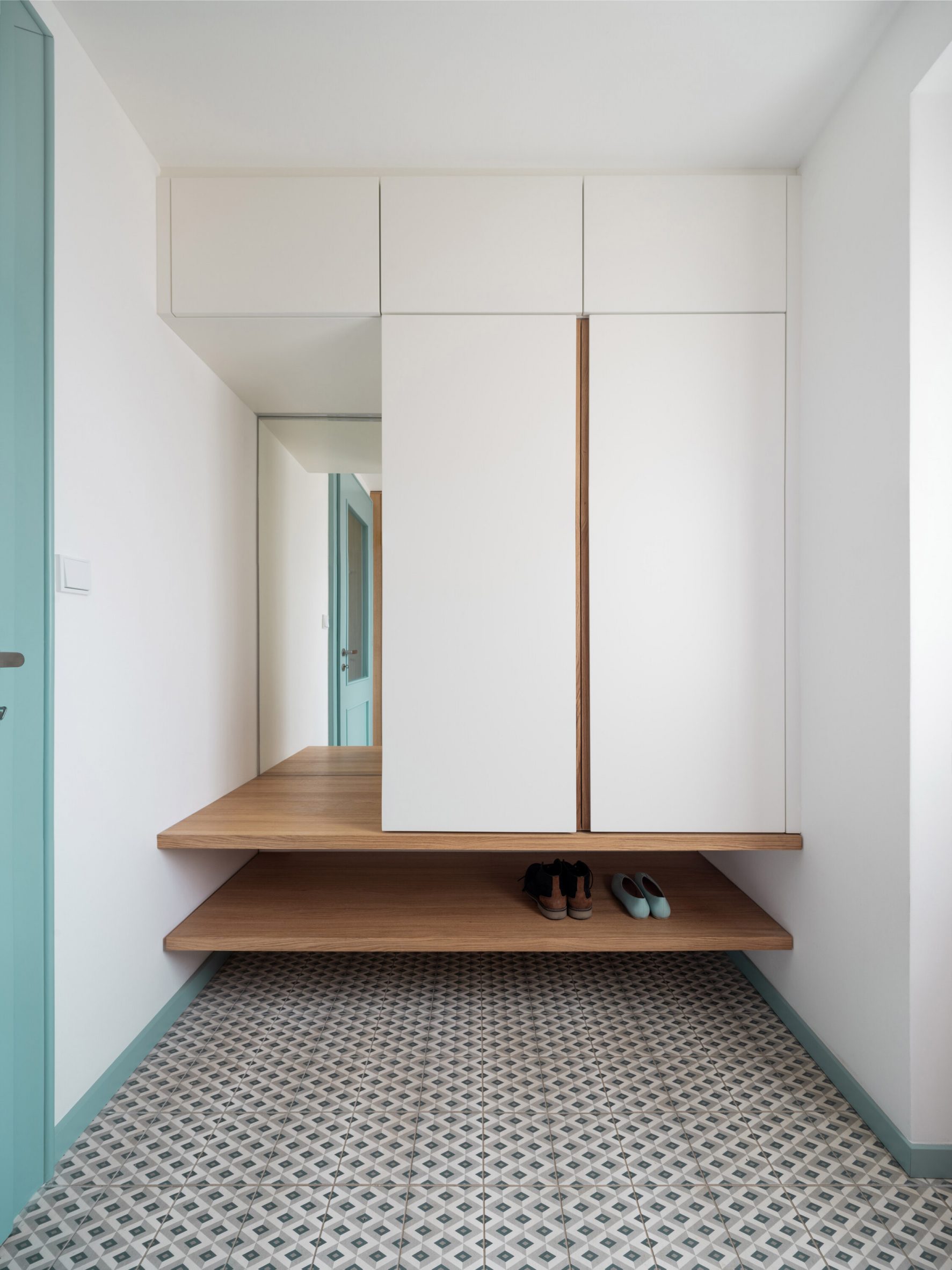 Bespoke shelving and cupboard at Under the Top House by No Architects