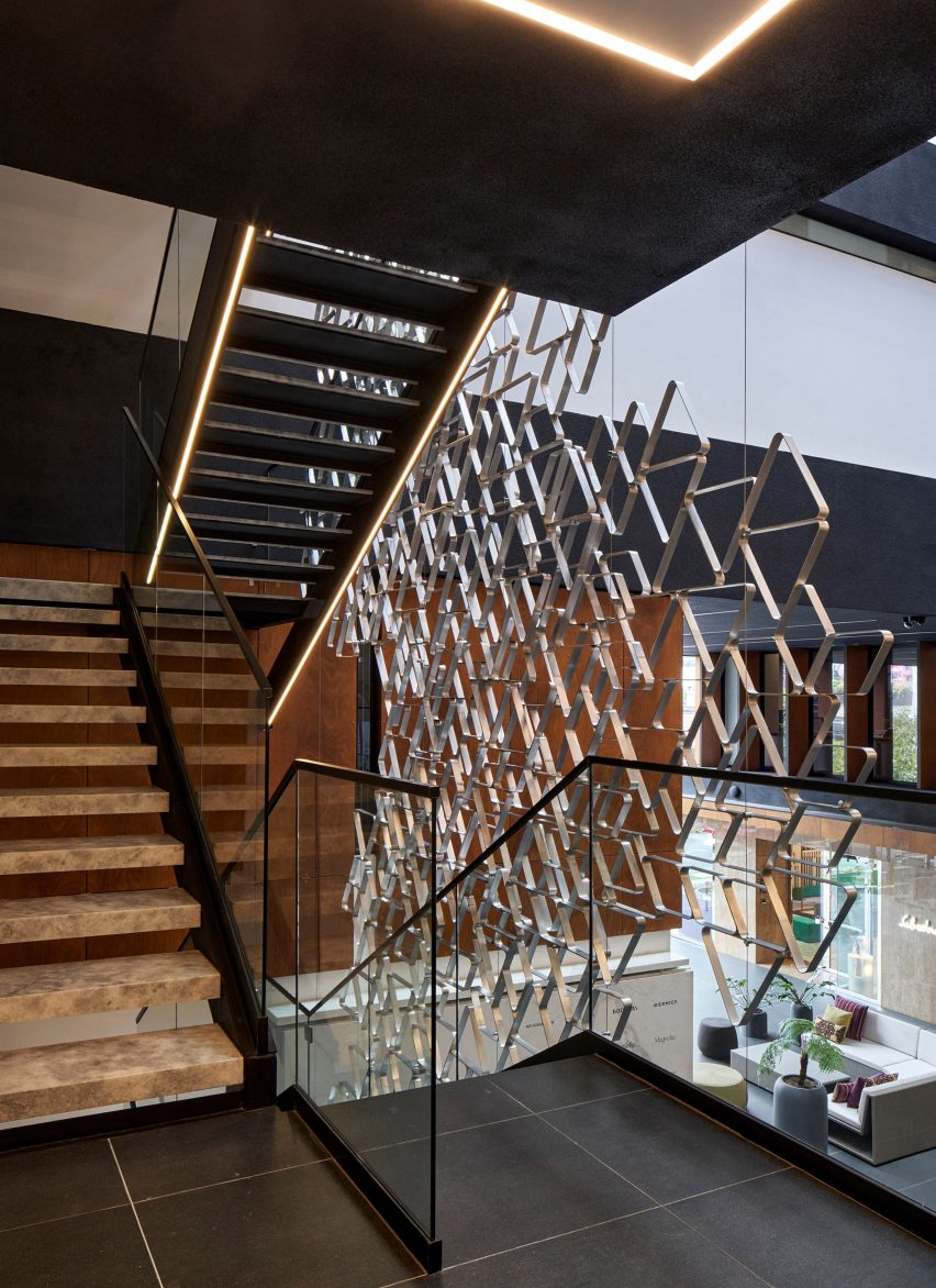 Sculptural staircase within building by Paz Arquitectura