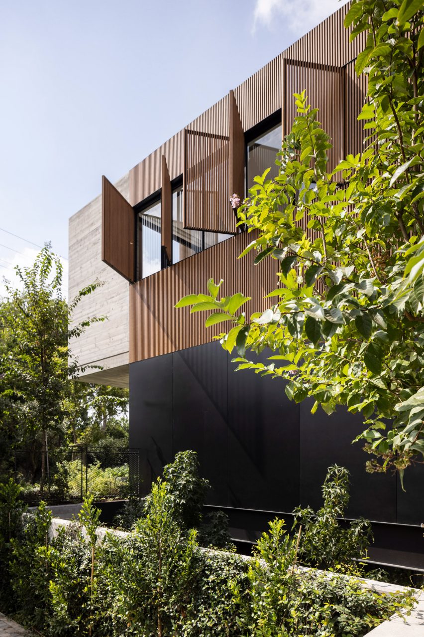 Exterior view of Wooden Slatted House by Pitsou Kedem