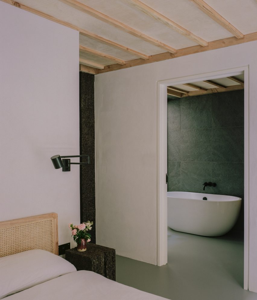 Interior image of a bedroom and bathroom