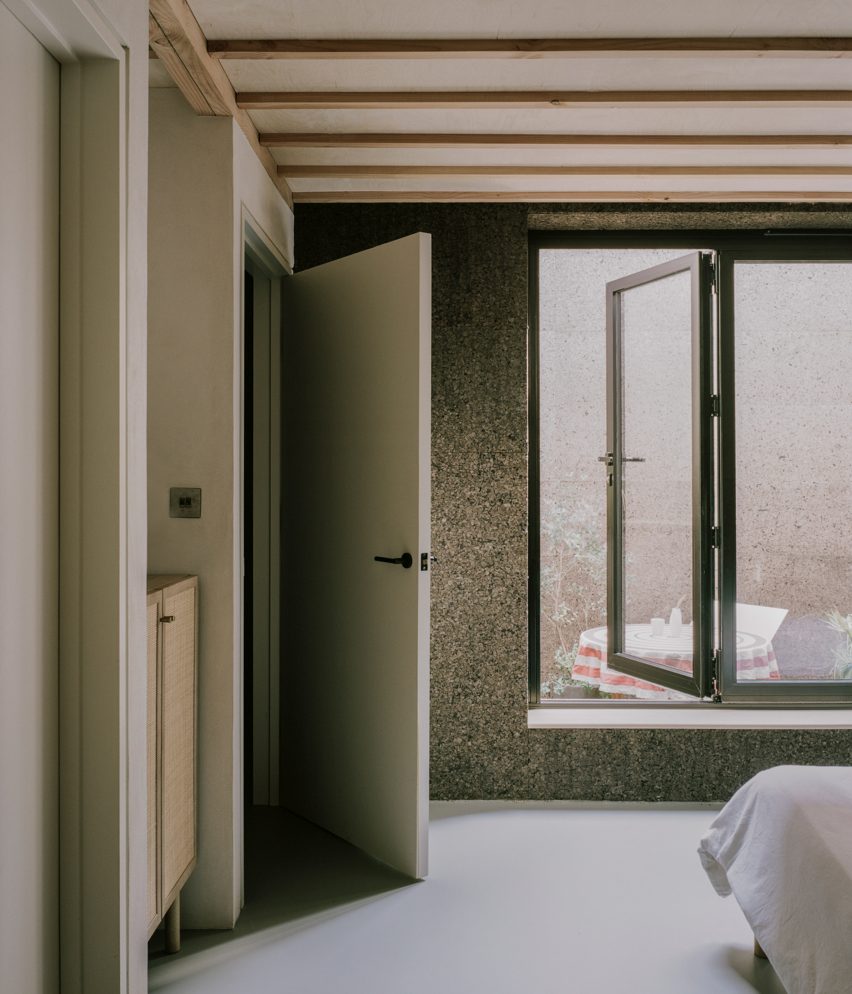 Interior image of a cork-lined bedroom at Cork House