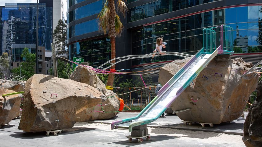 A girl climbs on Mike Hewson's Rocks on Wheels playground, Melbourne