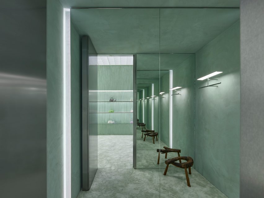 Interior rendering of a green fitting room that was covered with a soft carpet