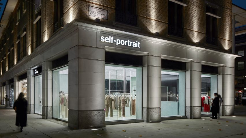 Exterior image of people walking past the Self-Portrait windows
