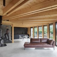 Stempel & Tesar architekti completes curved home overlooking a Czech forest