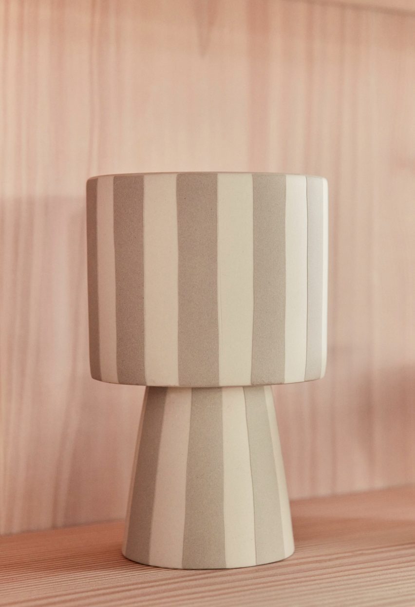 Photograph of stripy pot on ply shelf