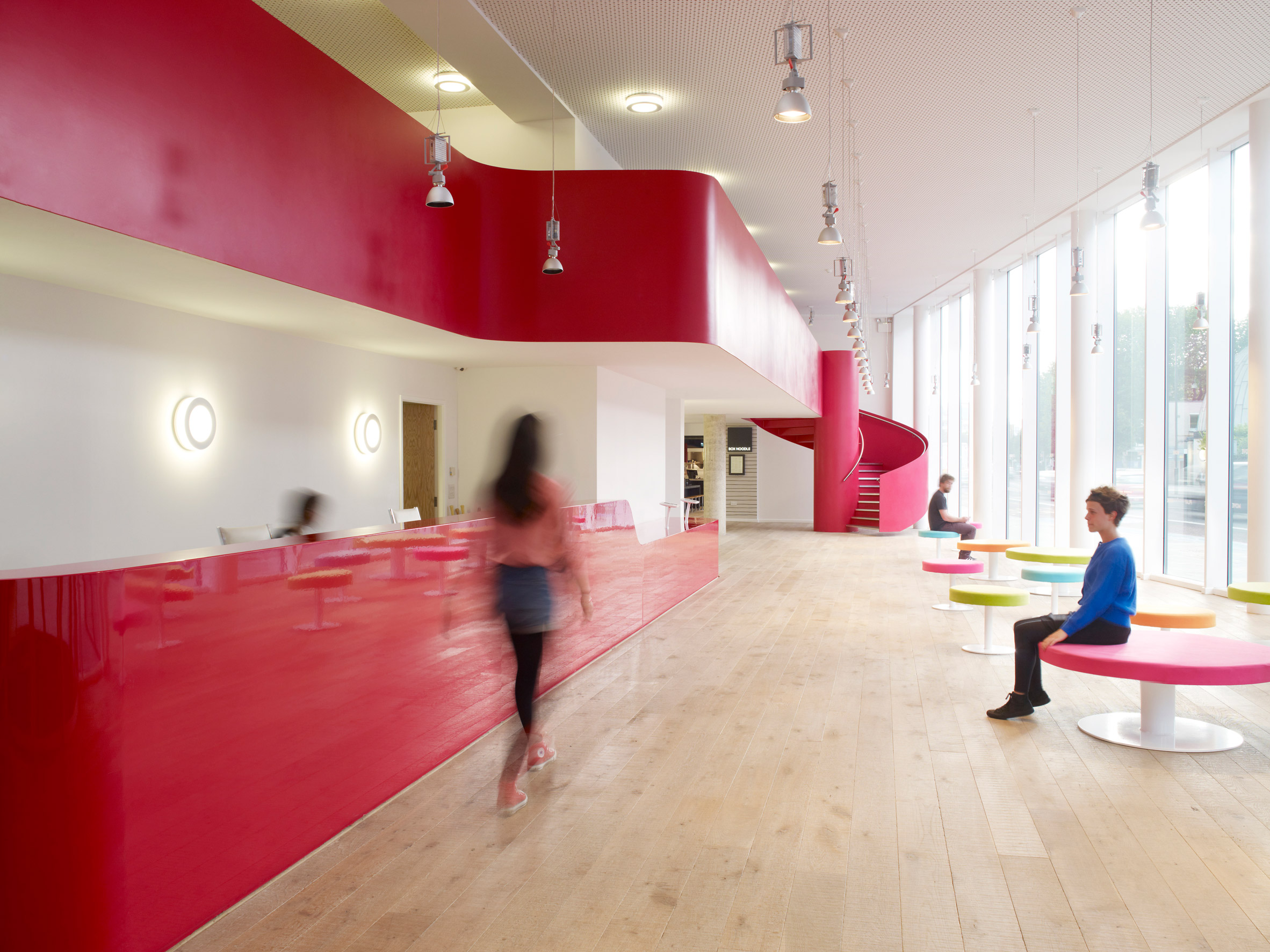 A student halls reception area with a pink desk