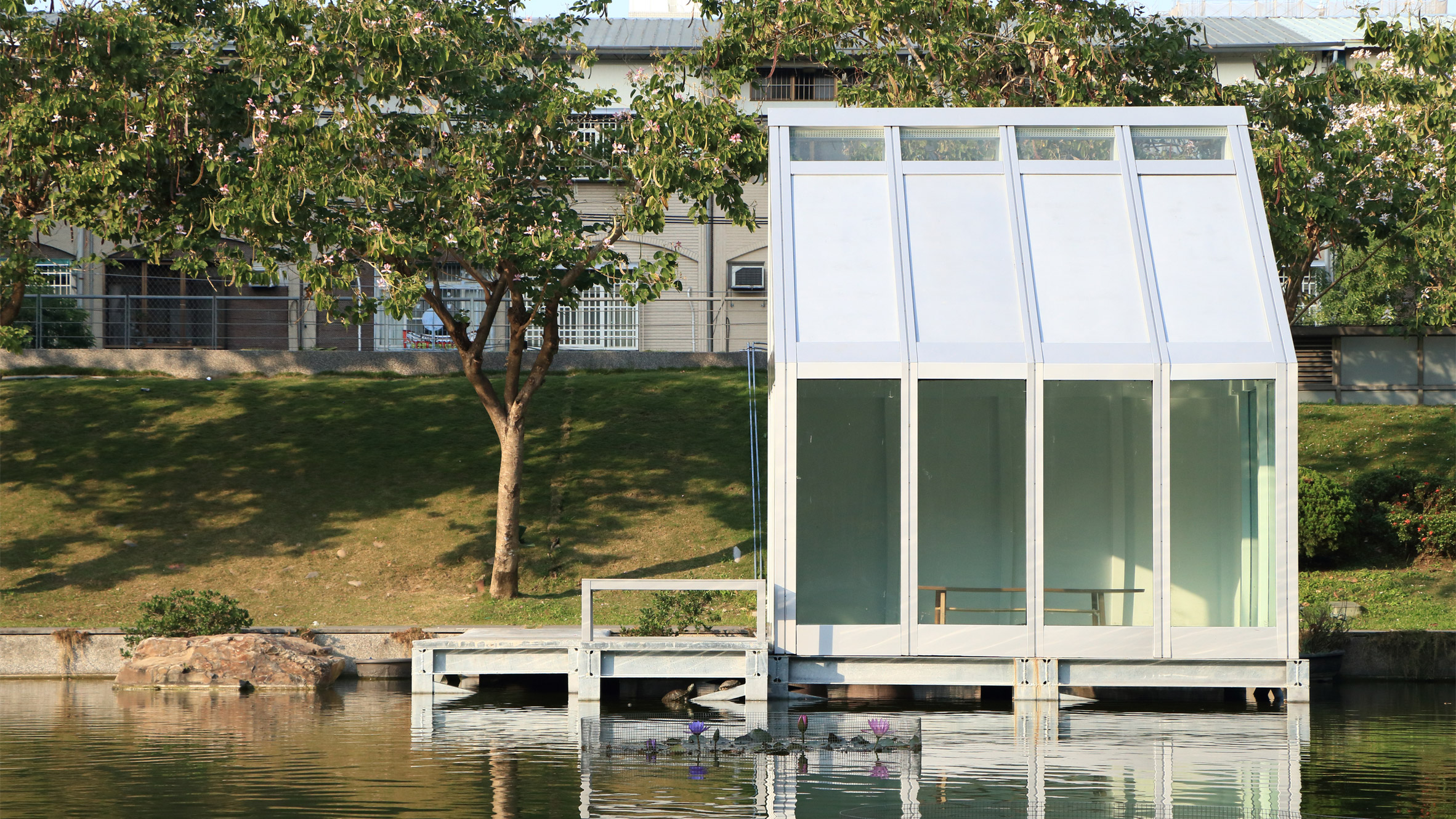 Glass house with water-filled windows
