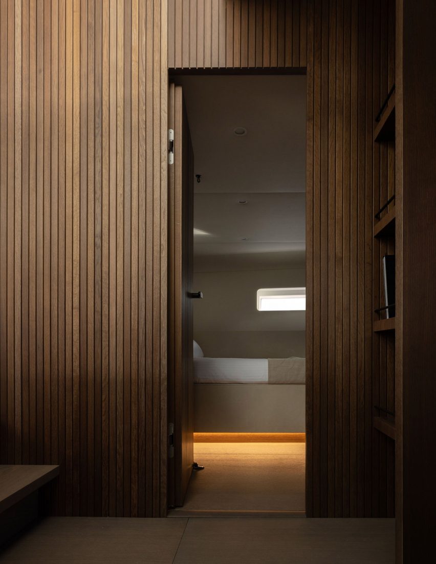 Wood-panelled walls in yacht interior designed by Norm Architects