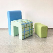 Photo of a blue and green chair and stool
