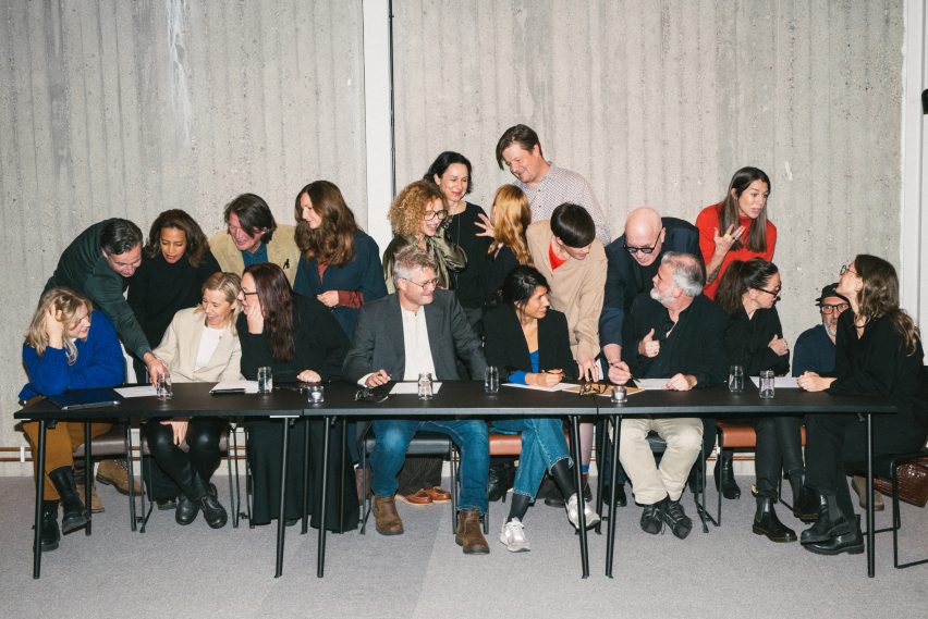 Image of group of people sat at a table