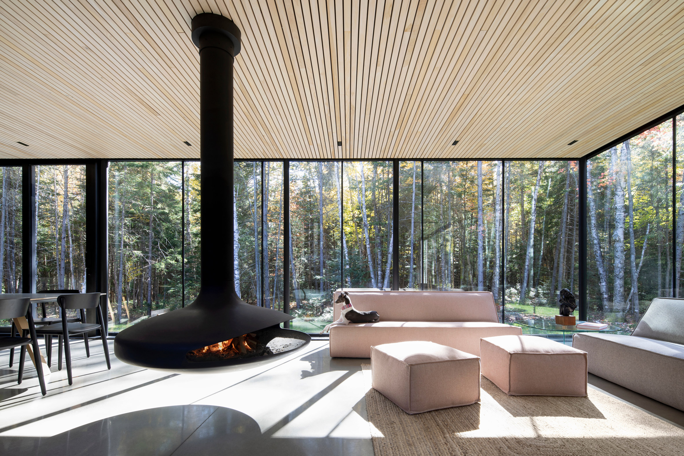 Open-plan living space with suspended fireplace