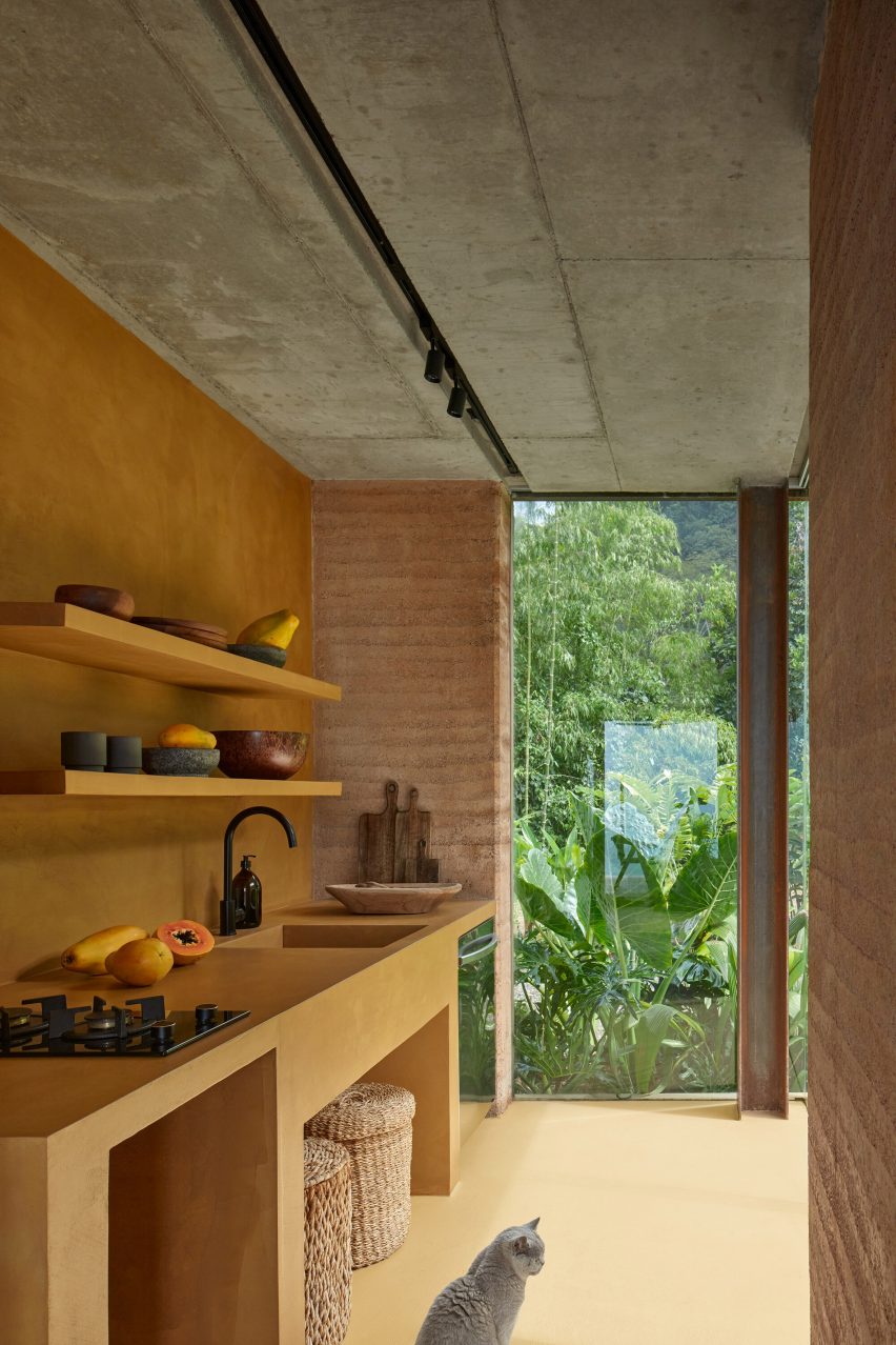 Yellow kitchen within villa by Formafatal