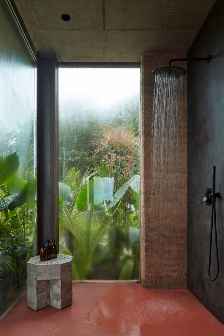 Waterfall shower head in bathroom within Costa Rican villa