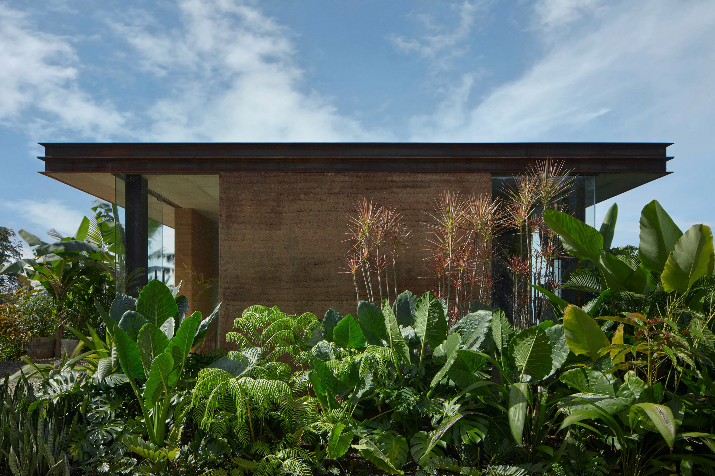 Rammed earth siding on villa in Costa Rican jungle