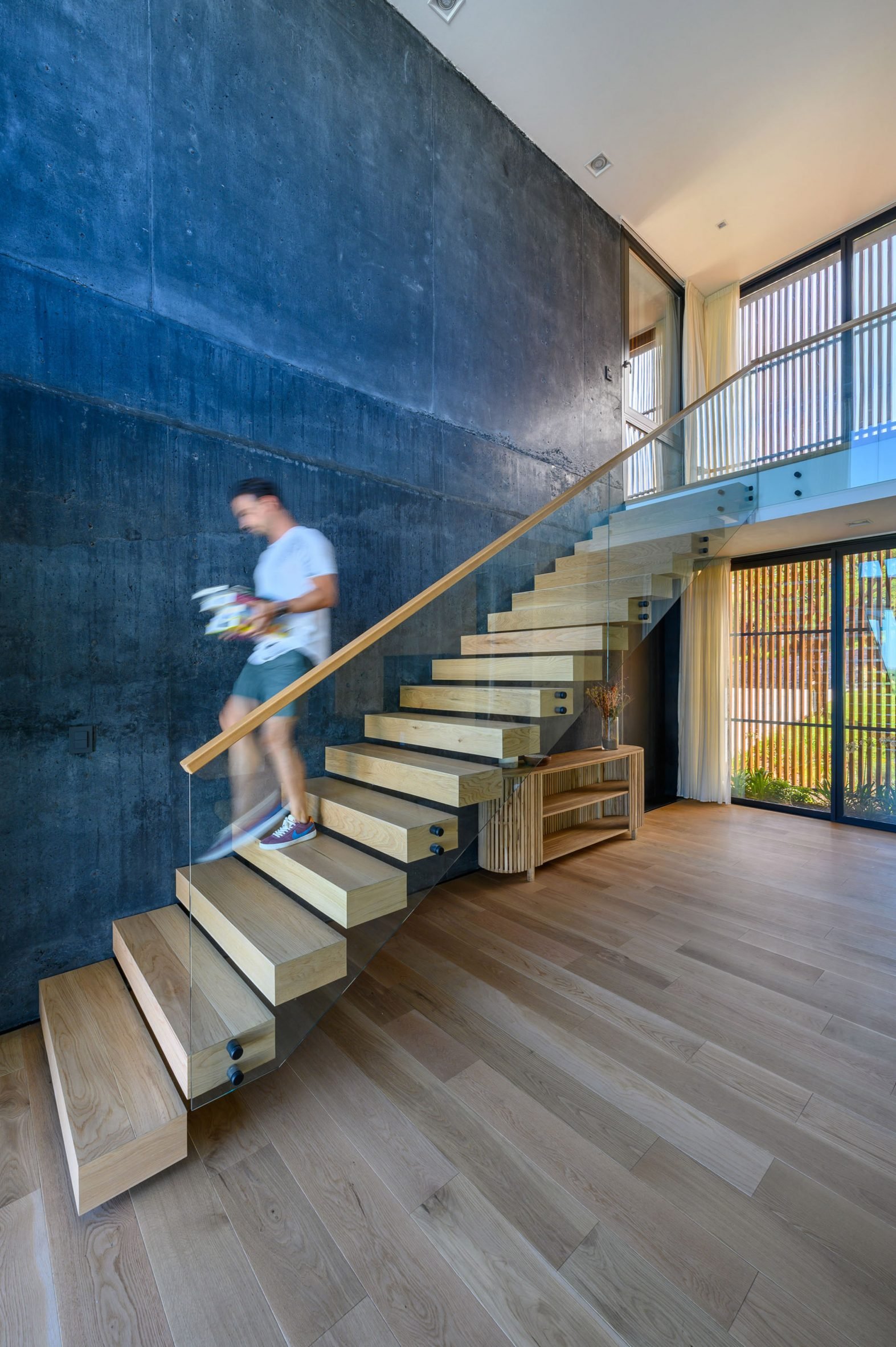 Interior staircase at the black concrete house by AR Arquitectos