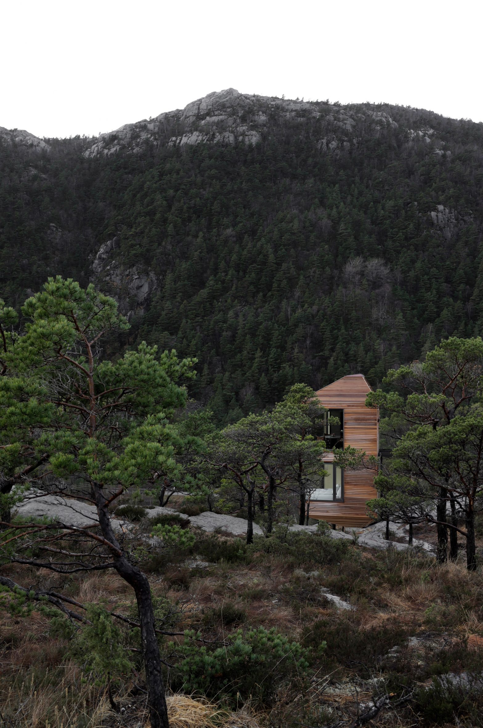 Wooden cabin in rural Norwegian landscape