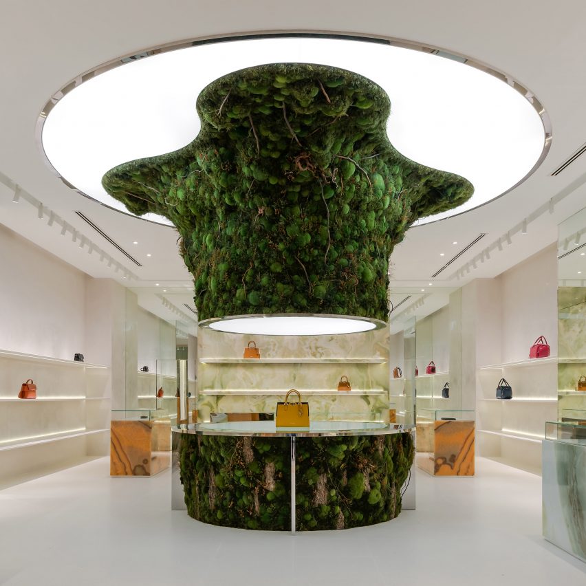 Biophilic design informs "otherworldly" moss-covered installation at luxury bag store
