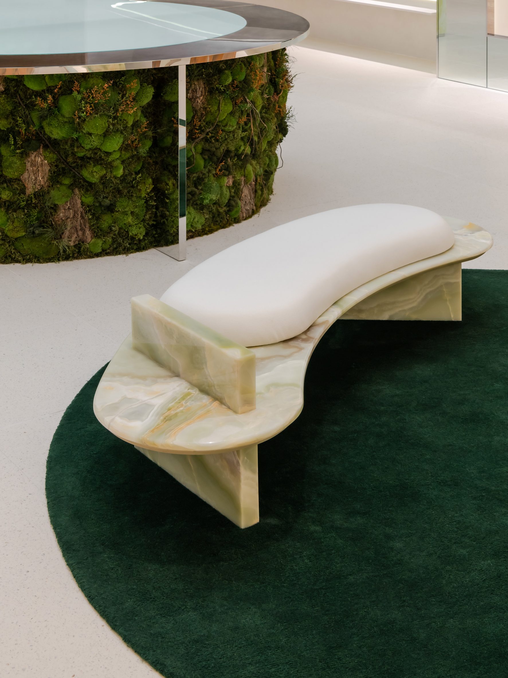 Biophilic design informs moss-covered installation at luxury bag store