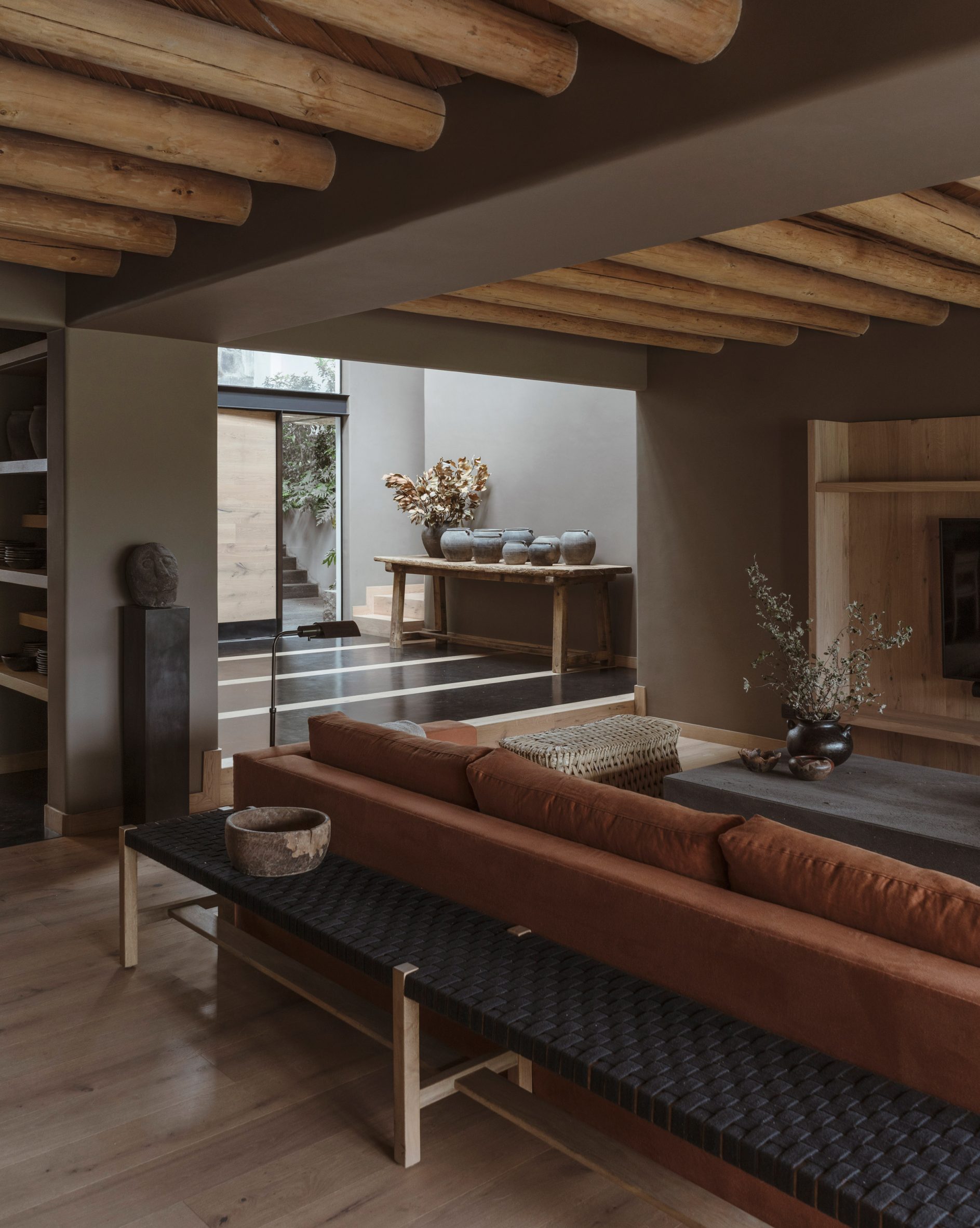 Lounge with red sofa, Casa Tres Árboles in Valle de Bravo by Direccion