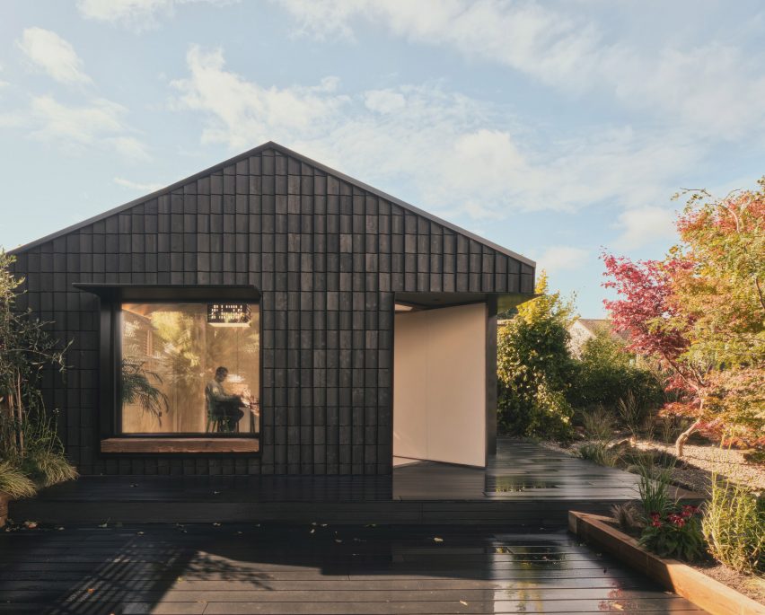 Charred wooden facade of Hyper's Dark Matter garden studio