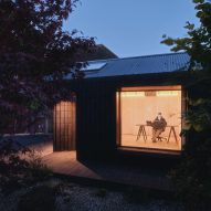Night view of Dark Matter garden studio by Hyper