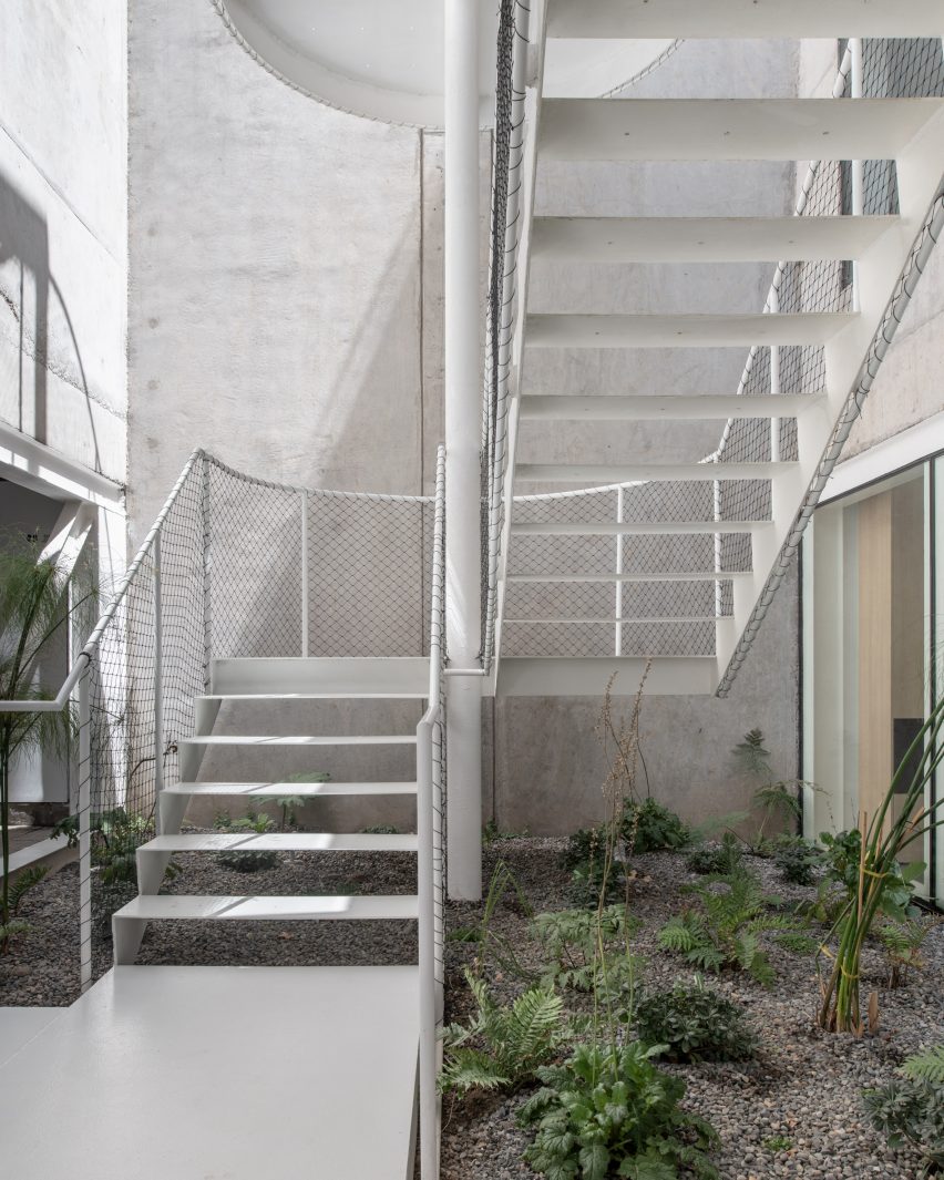 Steel-plated stairway in concrete courtyard