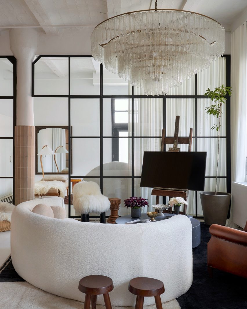 Living room with boucle sofa and giant crystal chandelier