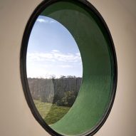 Circular window inside Casa Neptuna by Edgardo Giménez