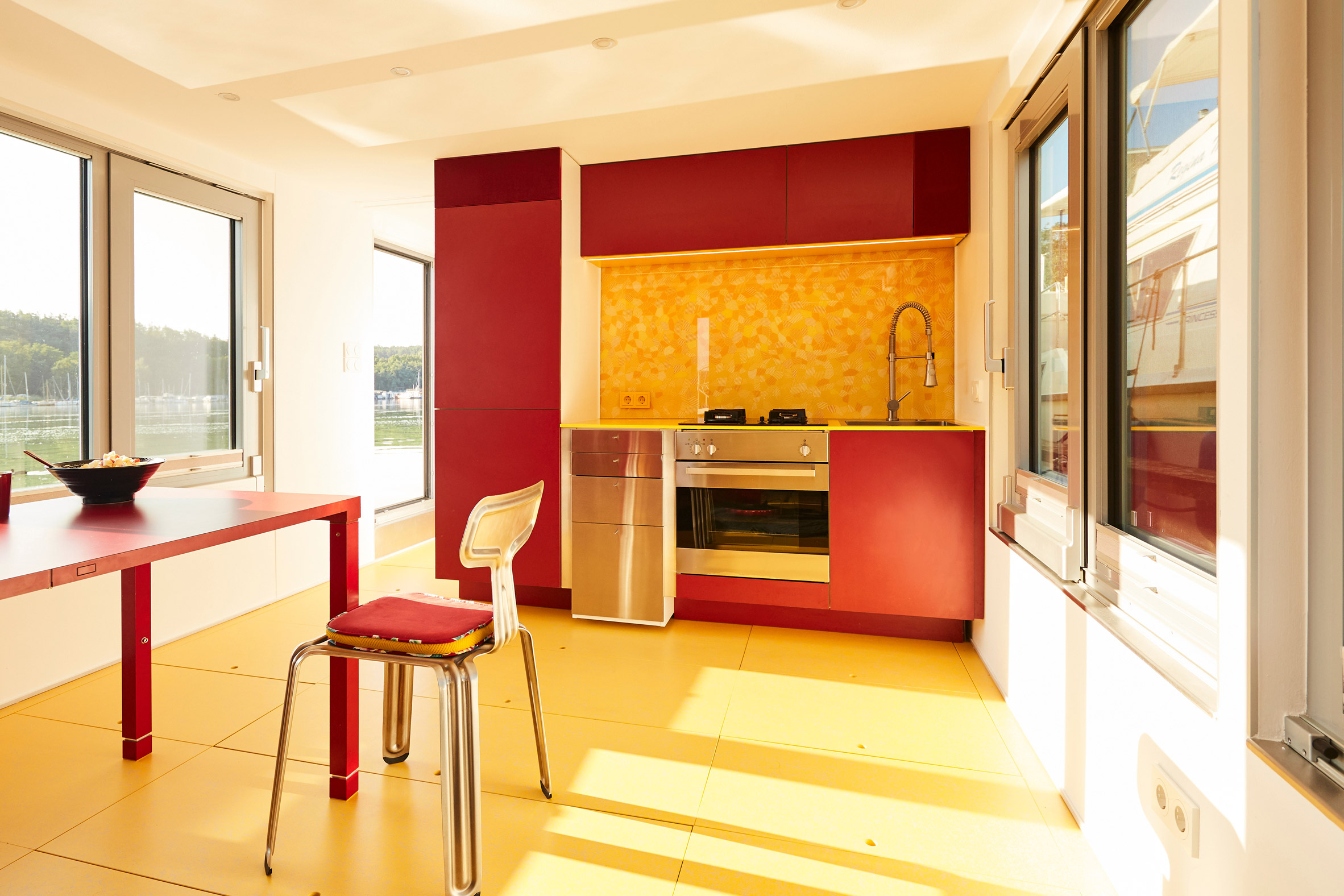 Red and yellow kitchen of houseboat