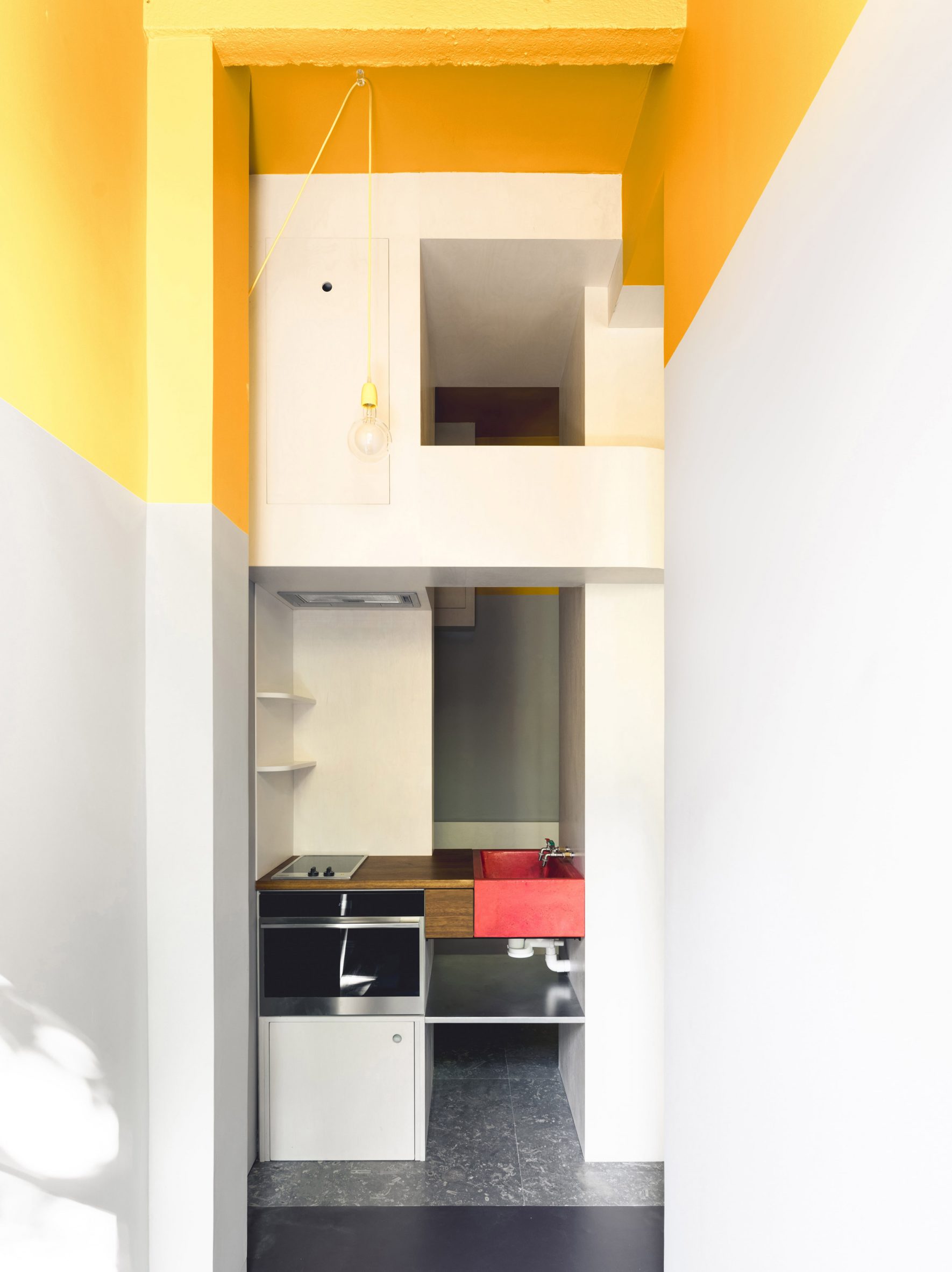 Tiny kitchen with geometric features in Glasgow micro apartment