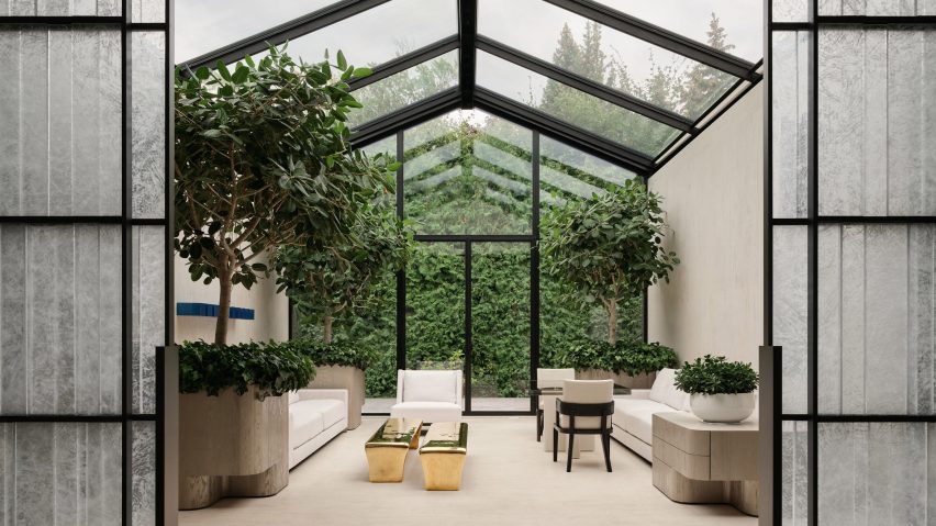 Conservatory featuring large trees and furniture