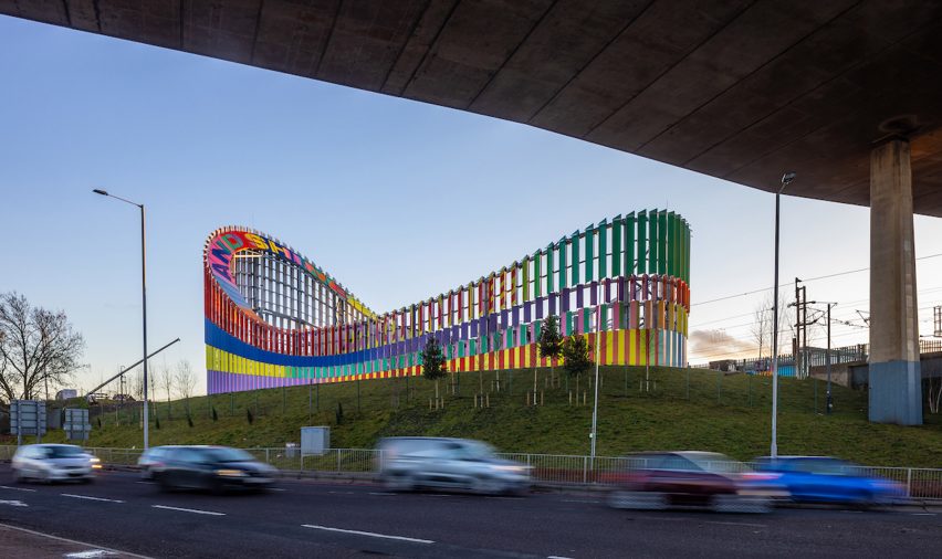 Colorful sculpture along busy road