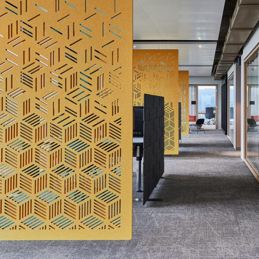 Yellow Archisonic wall panels by Impact Acoustic used as room dividers in an office
