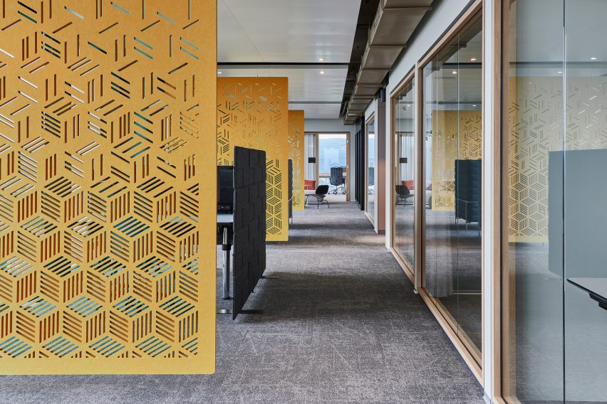Yellow Archisonic wall panels by Impact Acoustic used as room dividers in an office