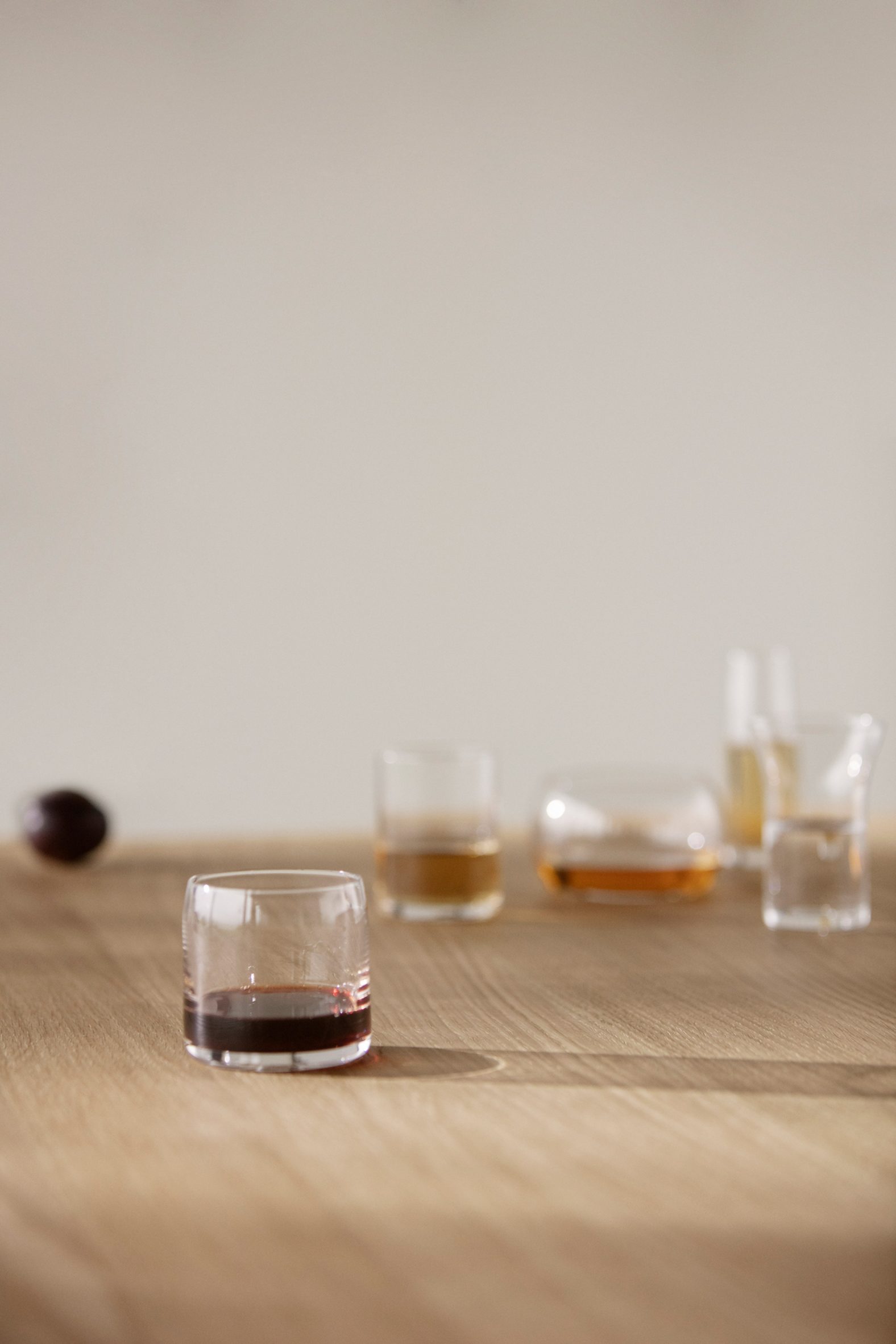 Photograph of glasses on wooden table