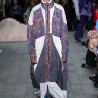 Menswear model wearing the Watered by One Water fashion collection