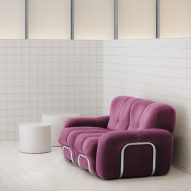White tiled ،e with purple sofa