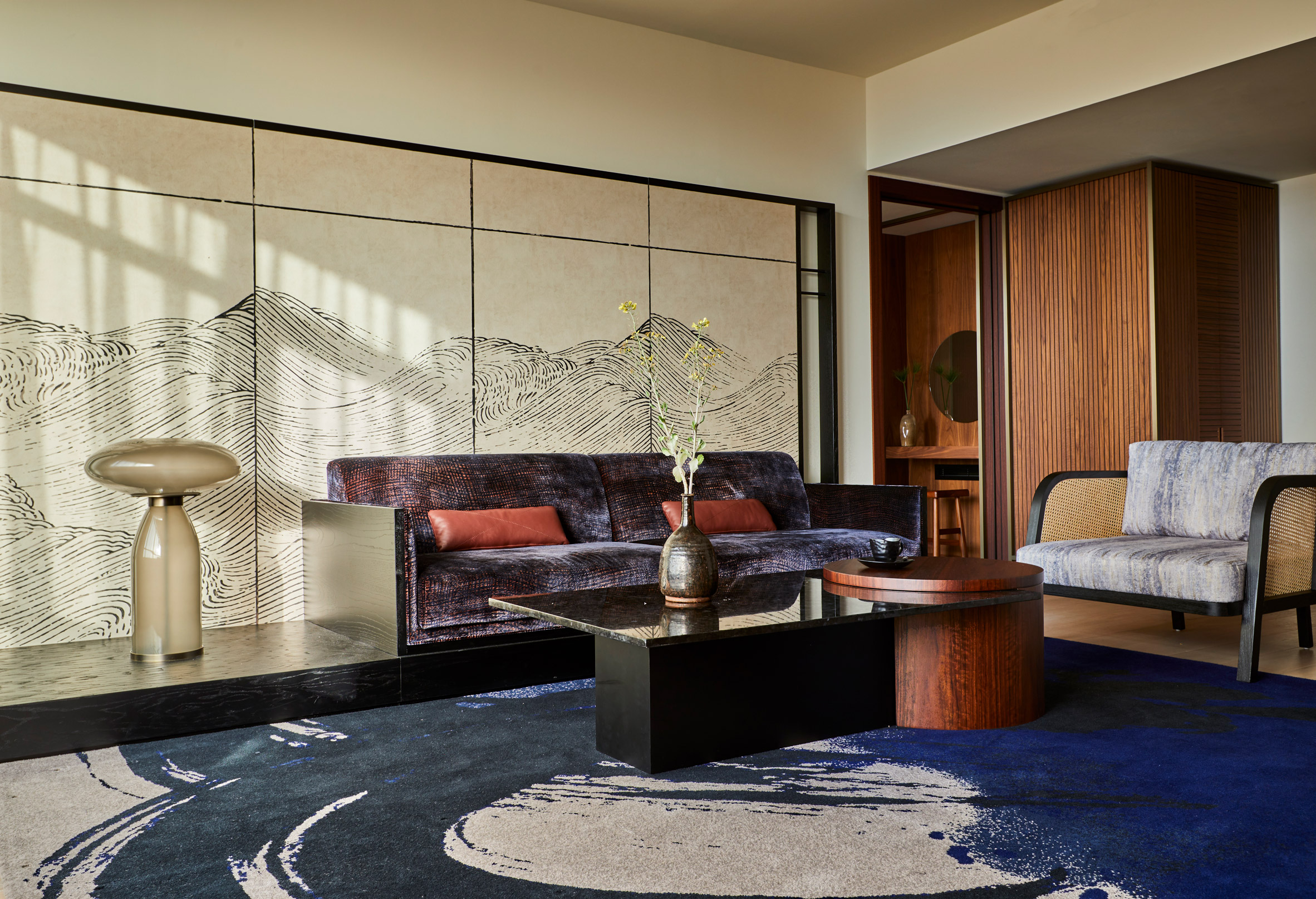 Jewel toned carpet and couch in Nobu Hotel Barcelona, Spain, by Rockwell Group