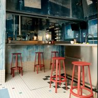 Oyster bar in Paris featuring coral-coloured stools and blue walls