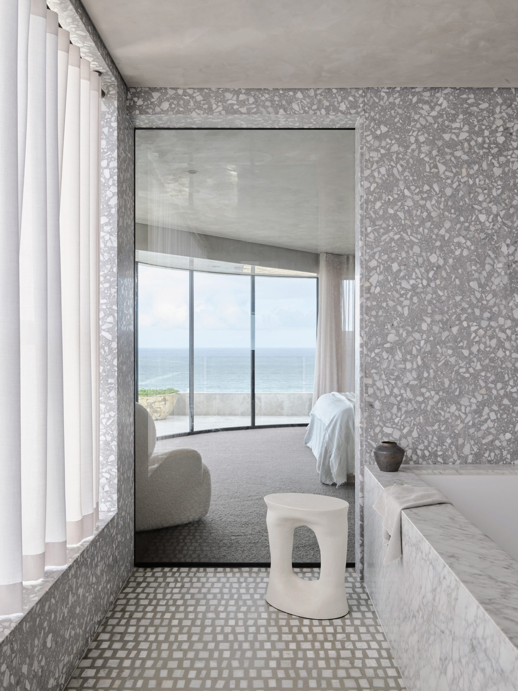 Bathroom interior by Alexander & Co with pattern-clashing greyscale surfaces